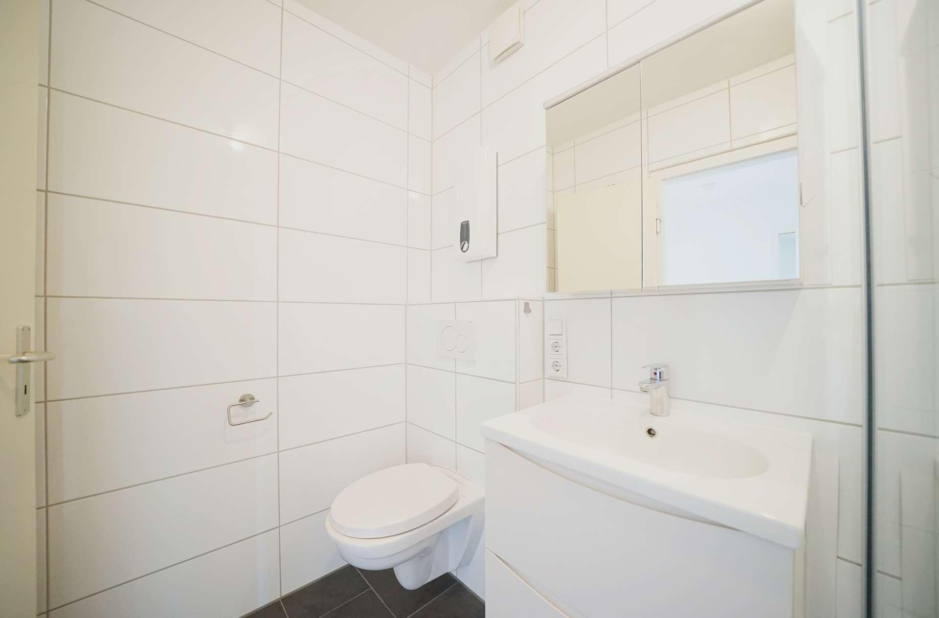 Bad DG – Mehrfamilienhaus mit drei Wohneinheiten und großem Keller, Bremen